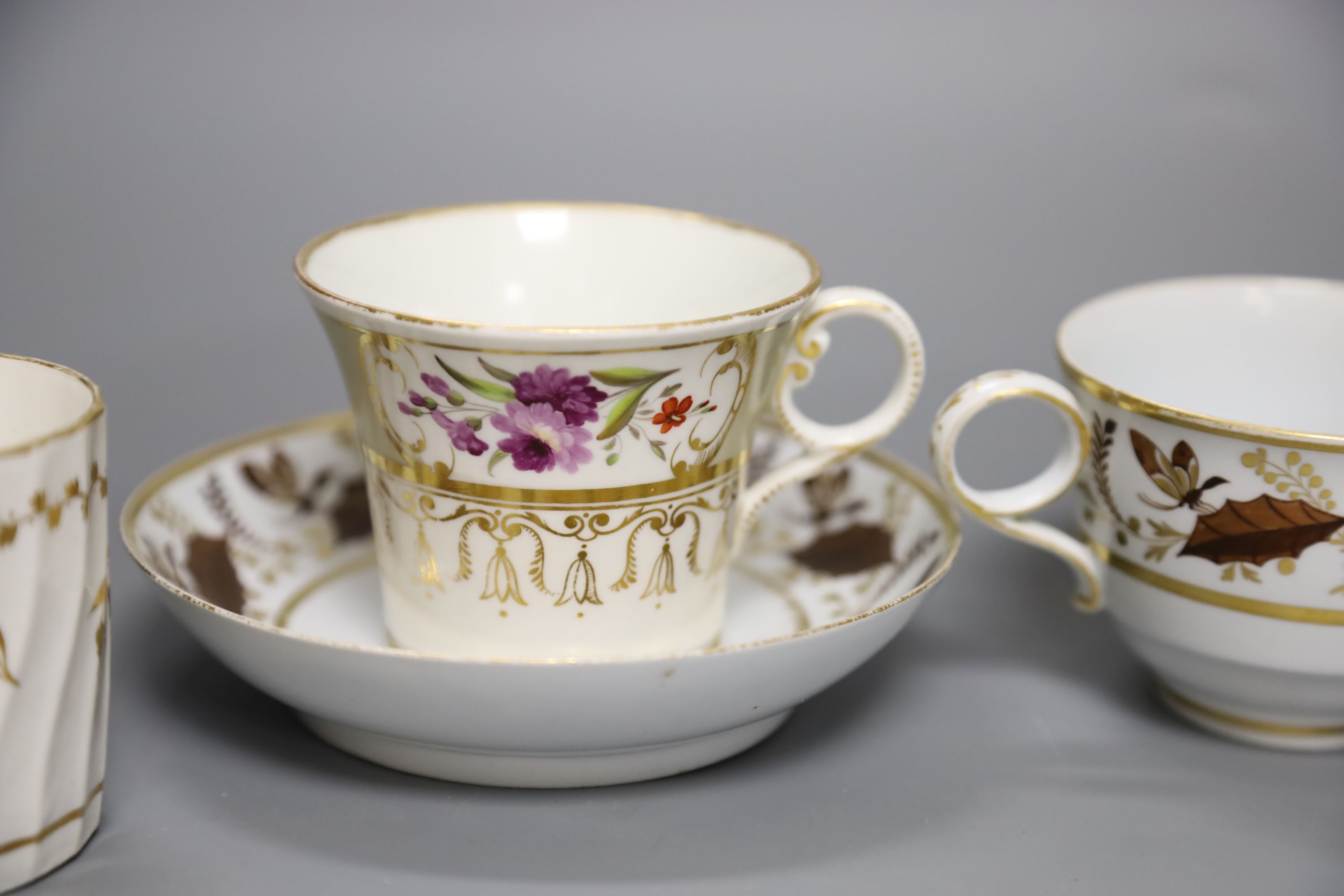 An early 19th century Worcester teacup and saucer painted with brown leaves with a landing insect, incised B, a Worcester coffee can